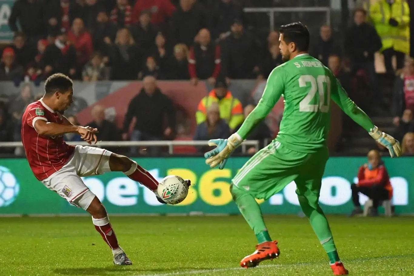 Player shooting on target with crowd in background illustrating the celebratory feeling after activating a 1xBet Bonus